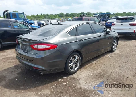 2015 Ford Fusion Energi Titanium z USA, uszkodzony, nr VIN 3FA6P0SU2FR179985